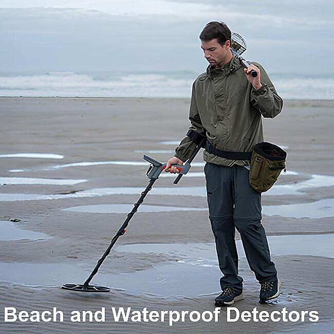 Metal detecting on beach and water Detectorist metal detecting beach